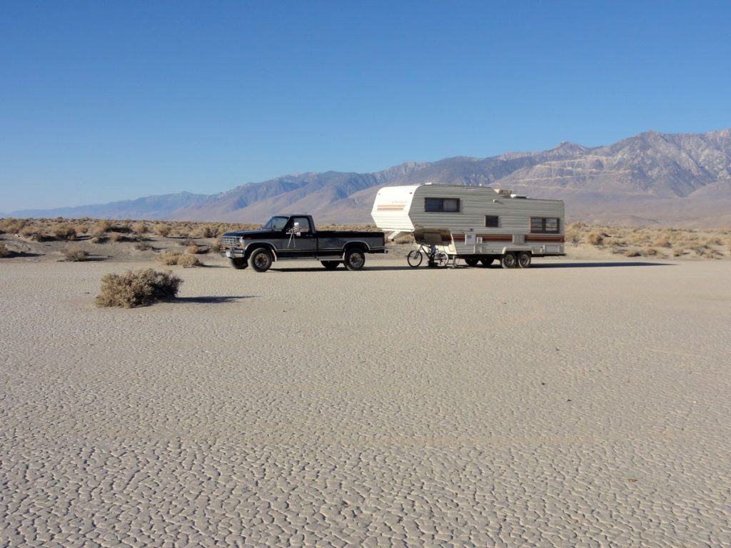 RV camping on a dry lake bed below Haystack Mountain